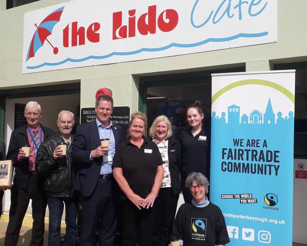 Matt Gladstone (centre) and Fairtrade Peterborough volunteers enjoying a round of Fairtrade coffee with the Lido Kiosk team