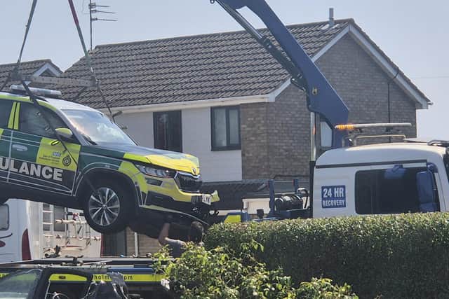 The ambulance rapid response vehicle is taken away from the scene of a traffic collision in Whittlesey