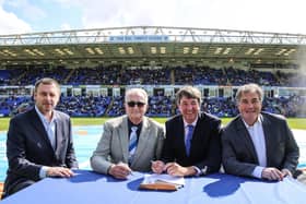 Peterborough United Co-Owners Stewart Thompson, Darragh MacAnthony and Jason Neale along with Councillor John Holdich, leader of Peterborough City Council signing off the sale of the ground on the pitch in 2021.