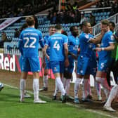 Peterborough United players celebrate the winning goal against Shrewsbury. Photo: Joe Dent/theposh.com.