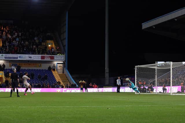 Jonson Clarke-Harris of Peterborough United has his penalty saved by Mansfield goalkeeper Christy Pym. Photo: Joe Dent/theposh.com
