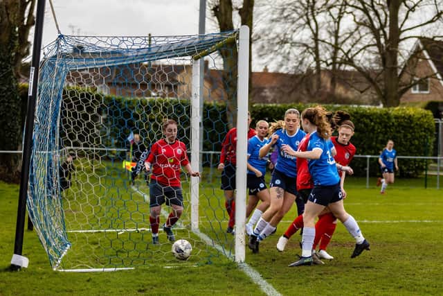 Posh open the scoring against Wem Town. Photo: Ruby Red Photography.