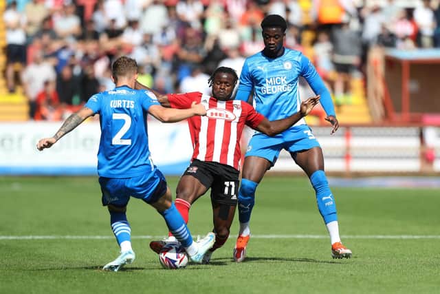 Posh pair Sam Curtis and Emmanuel Fernandez stop an Exeter City attack.  Photo Joe Dent/theposh.com.