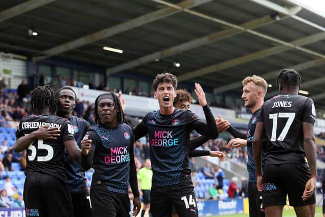 Joel Randall celebrates scoring his first goal with team-mates. Photo: Joe Dent.