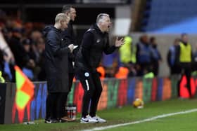 Peterborough United Manager Darren Ferguson exchanged words with a small number of Posh fans before half time against Barnsley. Photo: Joe Dent.