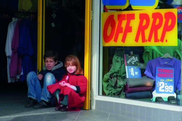 Emily Wright (nee Adams) and her brother Jimmy Adams were snapped in the doorway of the Madhouse shop in Bridge Street in 1991.