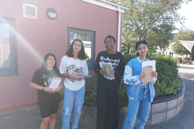 Smiling faces all round from students at St John Fisher on GCSE Results Day