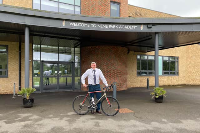 Nene Park Academy Principal Rob Grover ready with his bike.