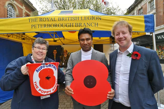 Sandy Foster receives £600 on behalf of the RBL Poppy Appeal from Zillur Hussain and Paul Bristow.