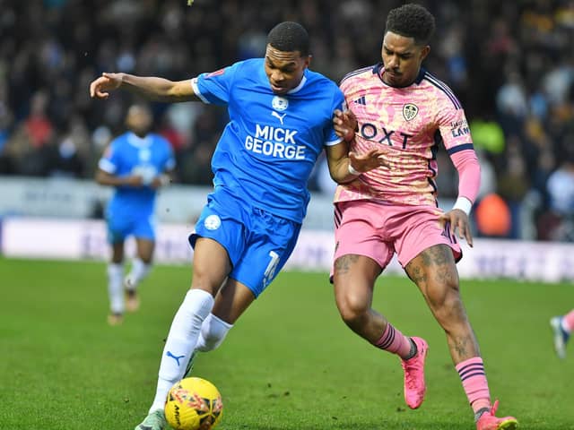 Malik Mothersille (left) in action for Posh. Photo David Lowndes.
