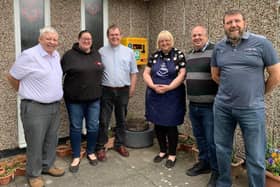 Cllrs Brian Rush (left), Ray Bisby and Chris Harper (right) with Gemma Wells from Gemma's Hearts and Rev Andrew and Carol Avery with the new defibrillator.