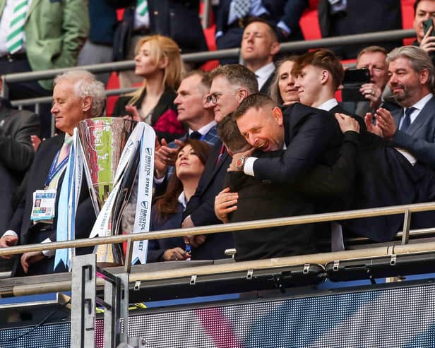 Darragh MacAnthony gives Darren Ferguson a warm welcome in the Royal Box after the win at Wembley. Photo Joe Dent/theposh.com.