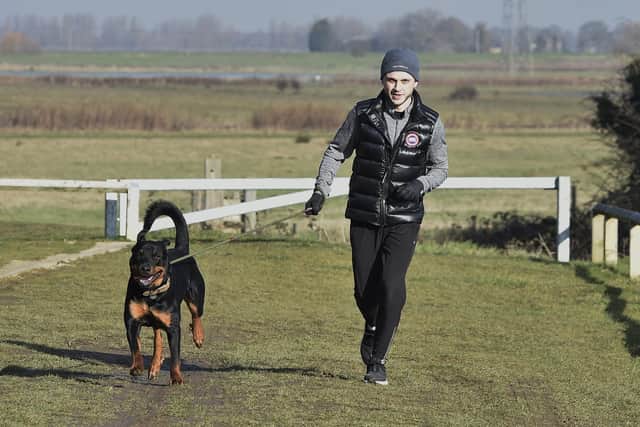 Joe Hambleton of Whittlesey training with his dog Hugo in preparation for a 60-mile charity running challenge next month