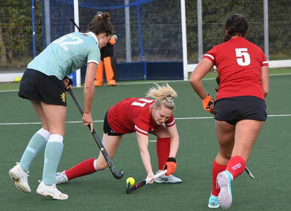 Action from City of Peterborough Ladies (red) v Cambridge University. Photo: David Lowndes.