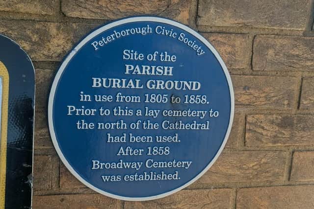 The blue plaque showing the burial ground location