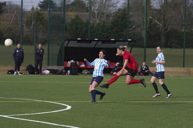 Katie Steward scores one of her 12 goals for Netherton against Cambourne. Photo: Tim Symonds.