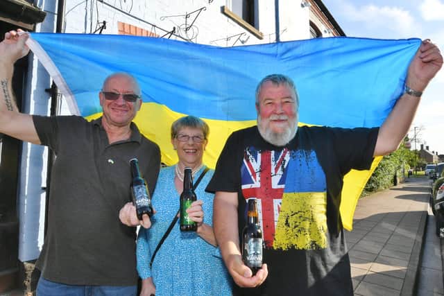 John and Judy Fox with John Lawrence (left), landlord of the Blue Bell pub in Werrington.