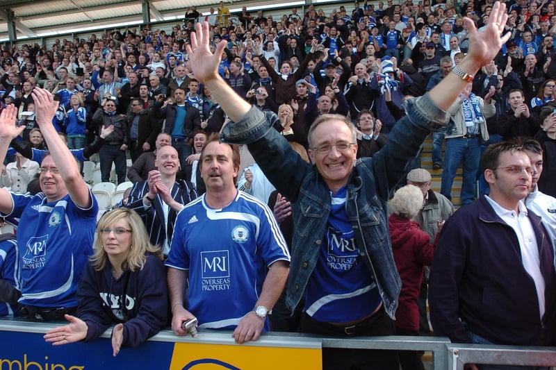 Peterborough united fans celebrate promotion to the Coca -Cola Championship following a 1-0 win over Colchester in the 2008/09 season.