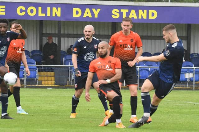 Josh McCammon (left) of Peterborough Sports tries to block a Scarborough shot. Photo: David Lowndes.