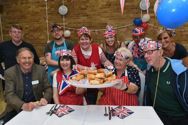 Mayor of Peterborough, Alan Dowson, with volunteers of the HELP charity at South Grove Community Centre and Dave Rowntree (front right), the drummer of the band Blur, at a Jubilee roast beef lunch for homeless and the lonely in the city.