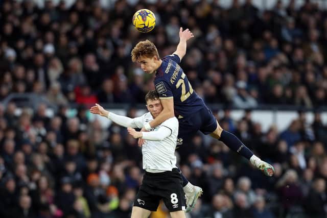 Hector Kyprianou of Peterborough United battles in the air with Max Bird of Derby County. Photo: Joe Dent/theposh.com