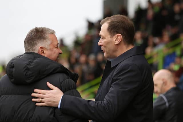 Peterborough United Manager Darren Ferguson (left) is greeted by Forest Green Rovers manager Duncan Ferguson before the game. Photo: Joe Dent/theposh.com.