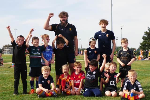 Borough U7s, who will be playing the first match of their lives this month, with coaches Bill Badger (right) and first XV vice-captain Robert Moulds.