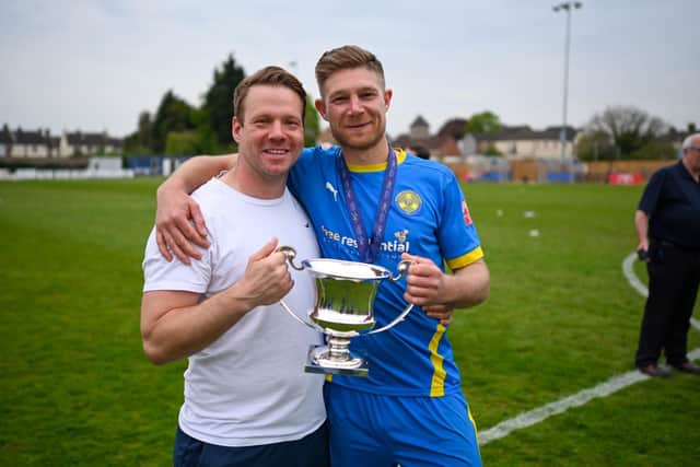Peterborough Sports manager Jimmy Dean (left) and captain Richard Jones celebrate promotion. Photo: James Richardson
