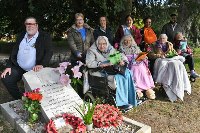 Residents and staff from the Lavender House care home laying flowers and cards on the grave of Jimmy the Donkey at Central Park (image: David Lowndes)