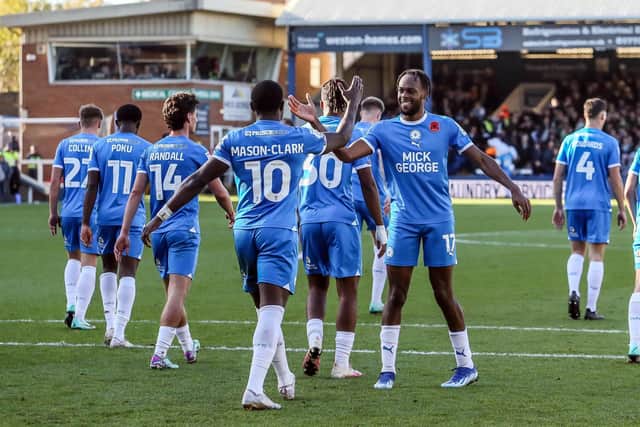 Ephron Mason-Clark is congratulated by Posh team-mate Ricky-Jade Jones after scoring his second goal of the game against Cambridge United earlier this season. Photo Joe Dent/theposh.com.