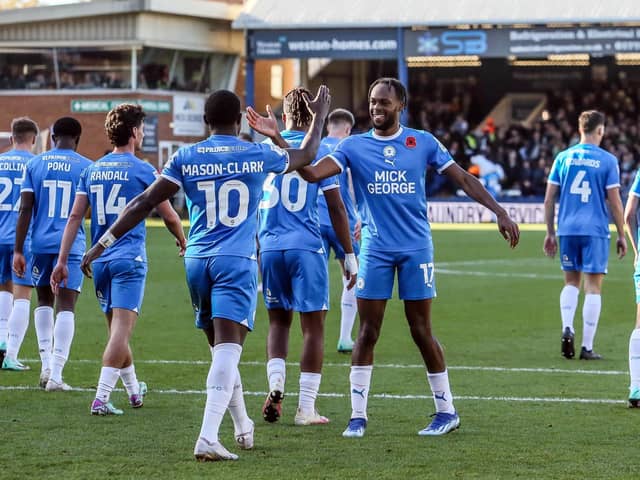 Ephron Mason-Clark is congratulated by Posh team-mate Ricky-Jade Jones after scoring his second goal of the game against Cambridge United earlier this season. Photo Joe Dent/theposh.com.