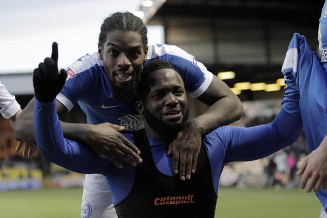 Junior Morias celebrates the first Posh goal of his career at Port Vale in January 2017. His Posh teammates is Anthony Grant.