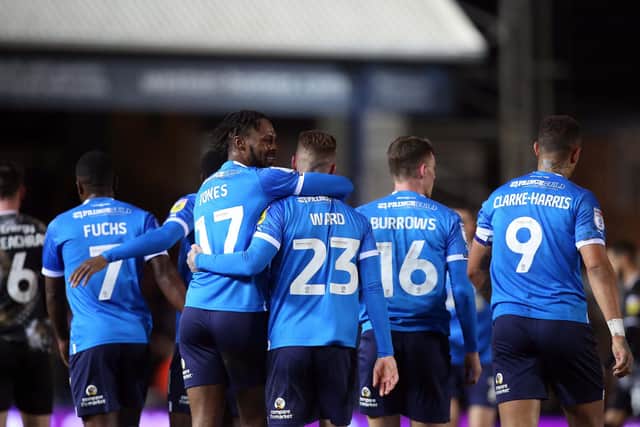 Peterborough United's Joe Ward and Ricky-Jade Jones celebrate the opening goal. Photo: Joe Dent.