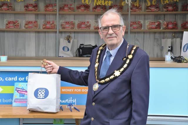 The Mayor of Whittlesey holding a goodie bag