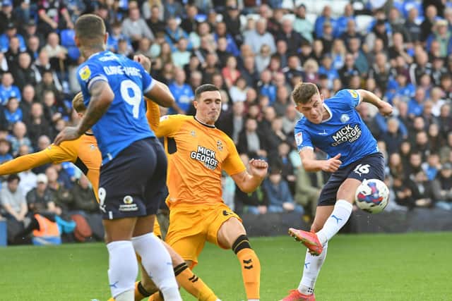 Posh star Harrison Burrows' shot against Cambridge United is blocked. Photo: David Lowndes.