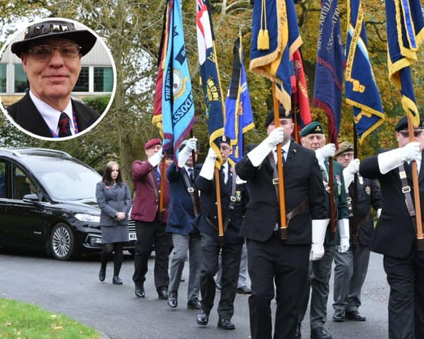 Royal British Legion Standards lead George's hearse into the crematorium