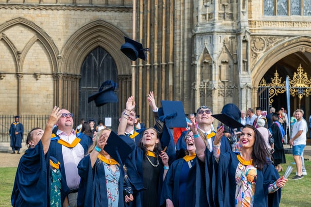 Hats in the air as students from University Centre Peterborough celebrate their degree success