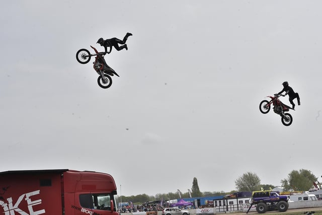 Truckfest 2023 at the East of England Arena. Broke FMX motorcycle stunt riders demo in the main ring.