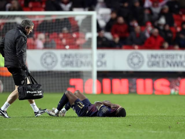Kwame Poku left the pitch after appearing in a lot of pain. Photo: Joe Dent.
