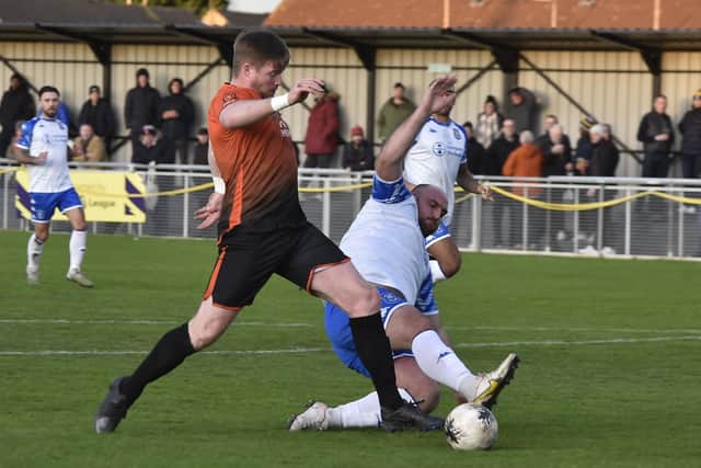 Joint-manager Michael Gash (orange) in action for Peterborough Sports. Photo David Lowndes.