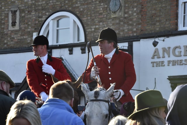 Riders and spectators gather outside the Angle in Stilton for the Fitzwilliam Hunt Boxing Day meet.