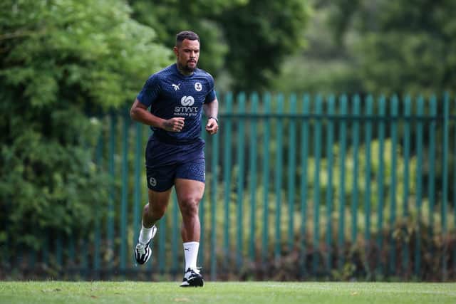 Transfer-listed Posh skipper Jonson Clarke-Harris on the run. Photo: Joe Dent/theposh.com