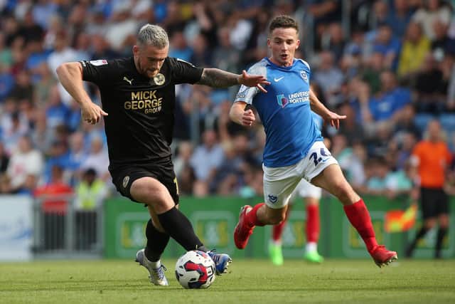 Posh striker Jack Marriott in action with Tom Lowery of Portsmouth, Photo: Joe Dent/theposh.com