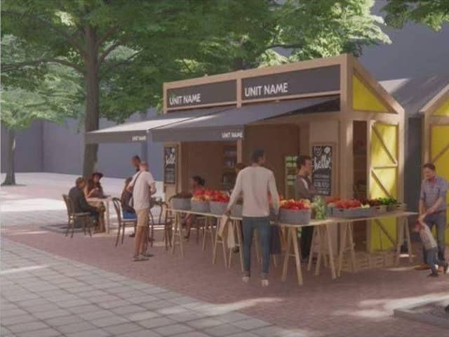 This image shows how the special wooden kiosks in Peterborough's new outdoor market in Bridge Street will appear once built. But the time taken to construct the kiosks has delayed the market's opening for a second time.