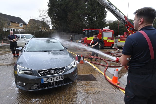 Stanground Fire Station green watch fire fighters at their annual Fire Fighters Charity car wash