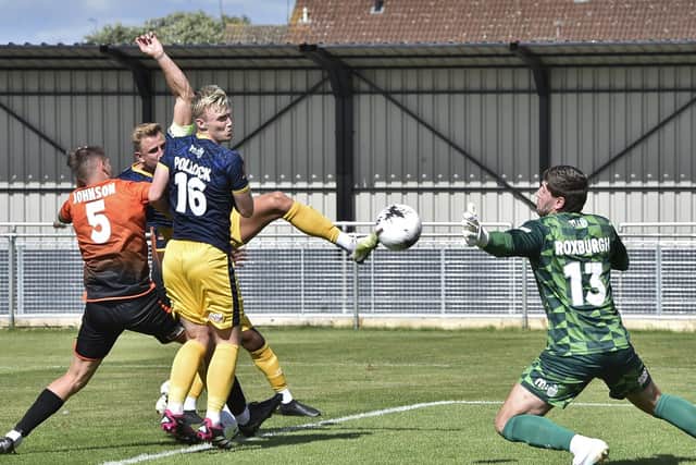 Action from Peterborough Sports (orange) v Spennymoor Town. Photo: David Lowndes.