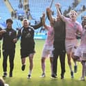Robbie Savage's new backroom team celebrate victory over Leicester. Photo: David Lowndes.