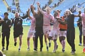 Robbie Savage's new backroom team celebrate victory over Leicester. Photo: David Lowndes.