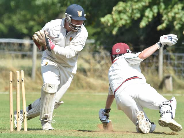 Stamford Town wicket-keeper Andrew Hulme in action.