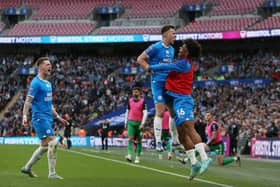 Posh skipper Harrison Burrows celebrates the winning goal at Wembley with substitute James Dornelly. Photo Joe Dent/theposh.com.